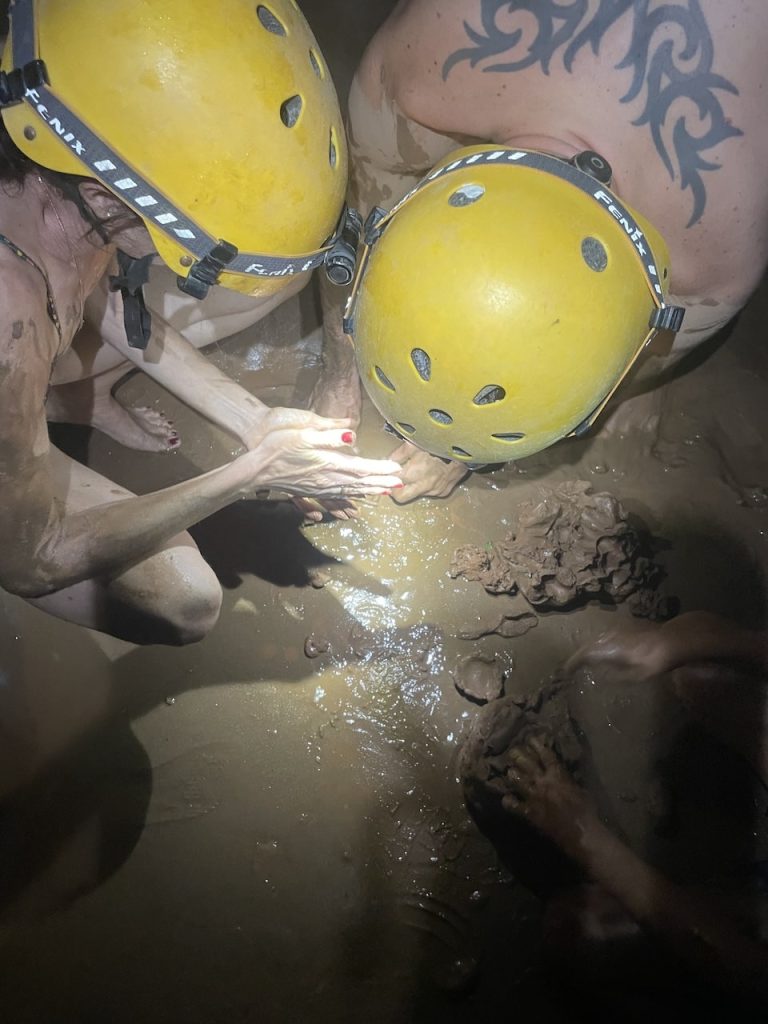 Having fun with mud in the Dark cave