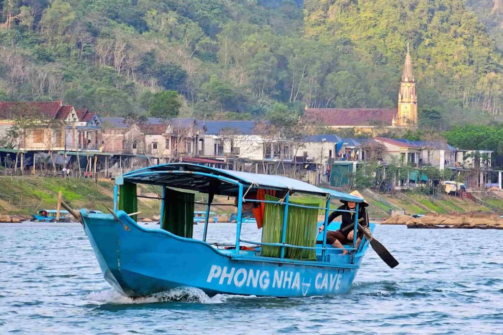 Blue motorized boat in Phong Nha